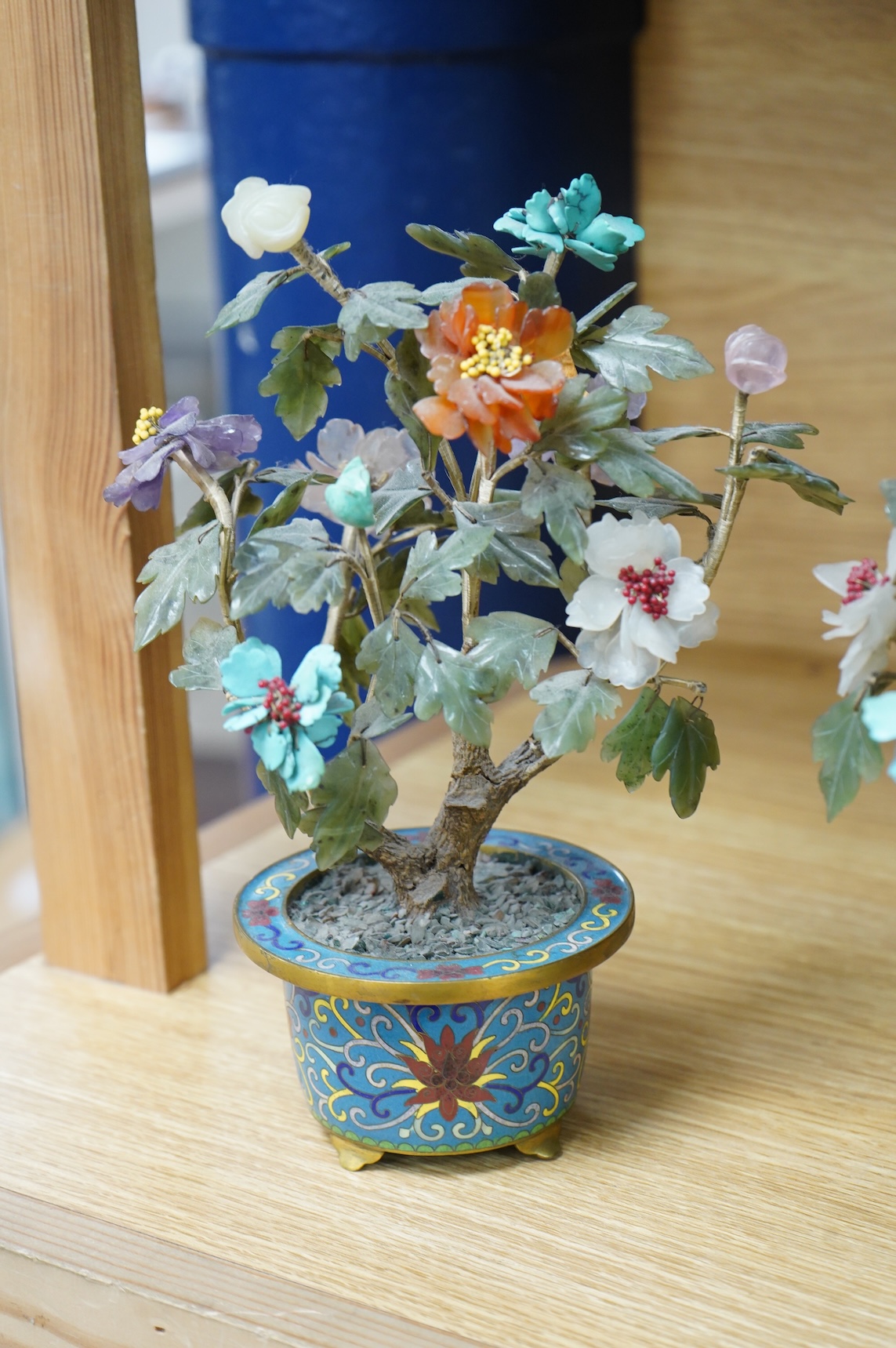 A pair of Chinese hardstone trees, in cloisonne jardinieres, 23cm high